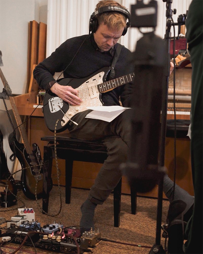 Pétur Ben playing guitar in studio Útlandia